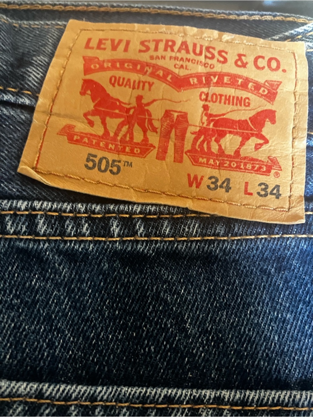 Levi's 505 Relaxed Fit Jeans in Dark Blue Denim with Tan Leather Patch